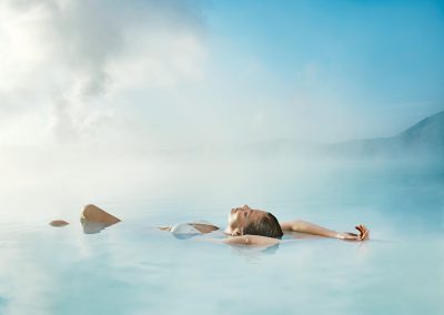 Woman relaxing in Blue Lagoon spa in Iceland