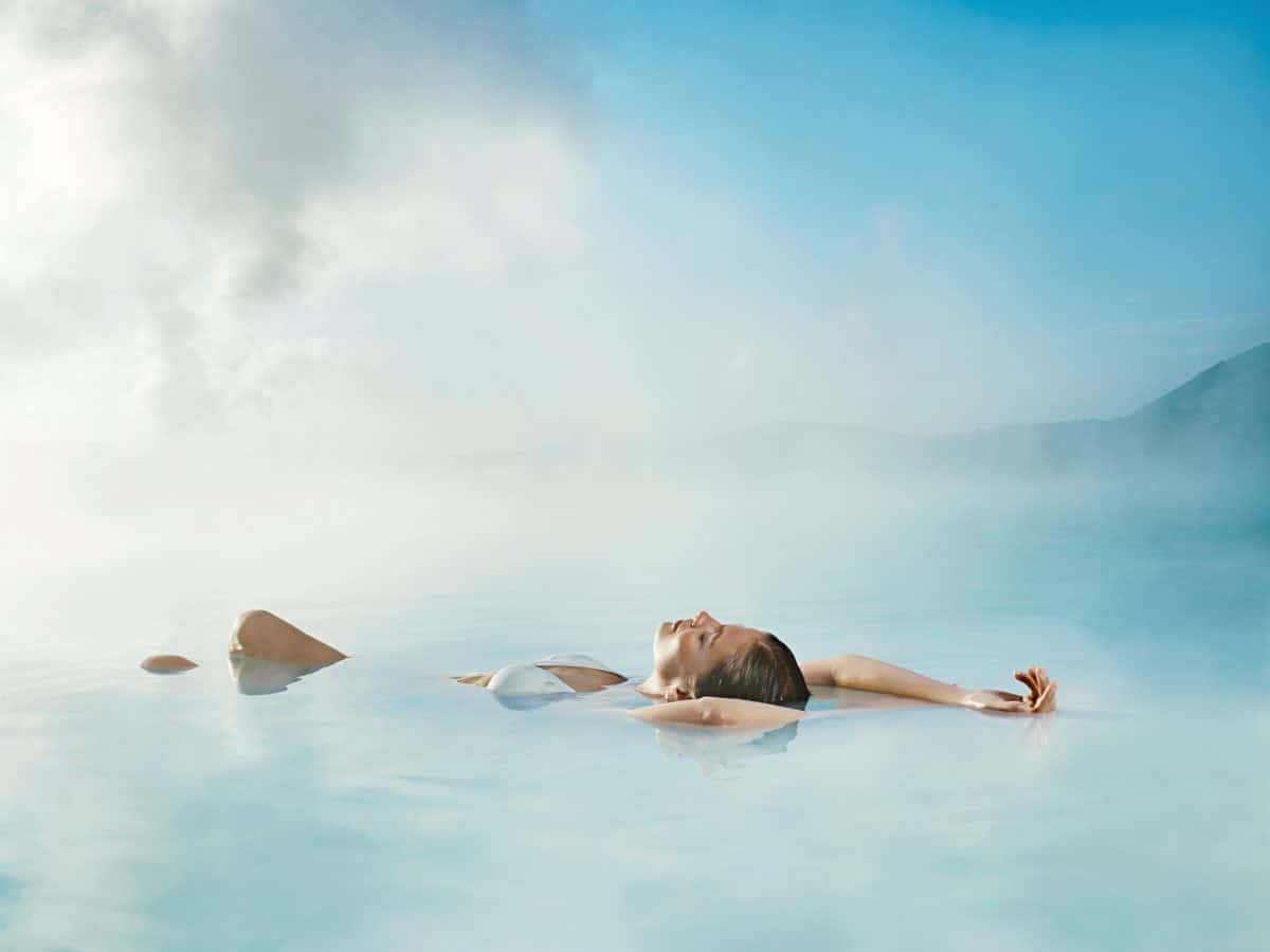 Woman relaxing in Blue Lagoon spa in Iceland
